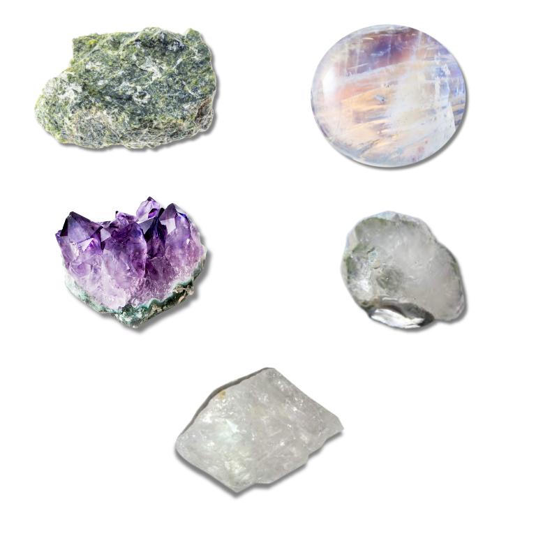 Assorted crystals including serpentine, moonstone, amethyst, phenacite, and azeztulite